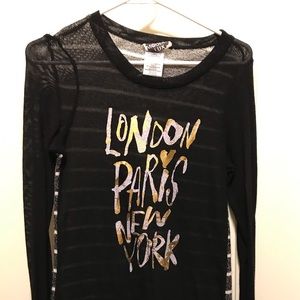 This is a medium junior size long sleeve tee.